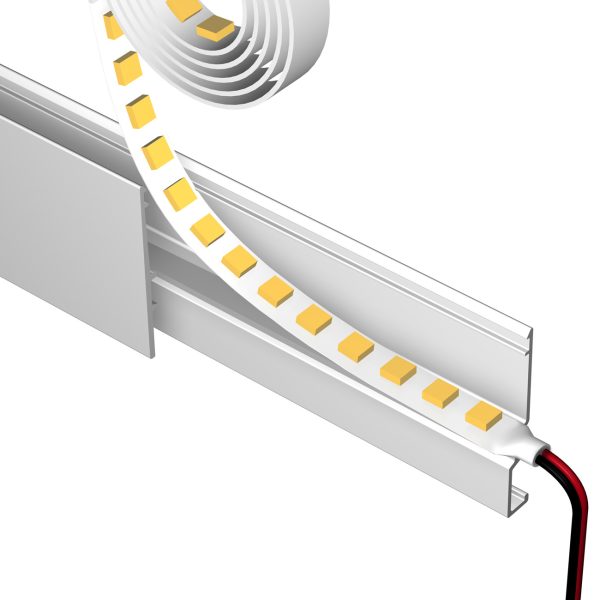 LED strip light with yellow diodes mounted inside a white aluminum channel and a red/black power cable connected
