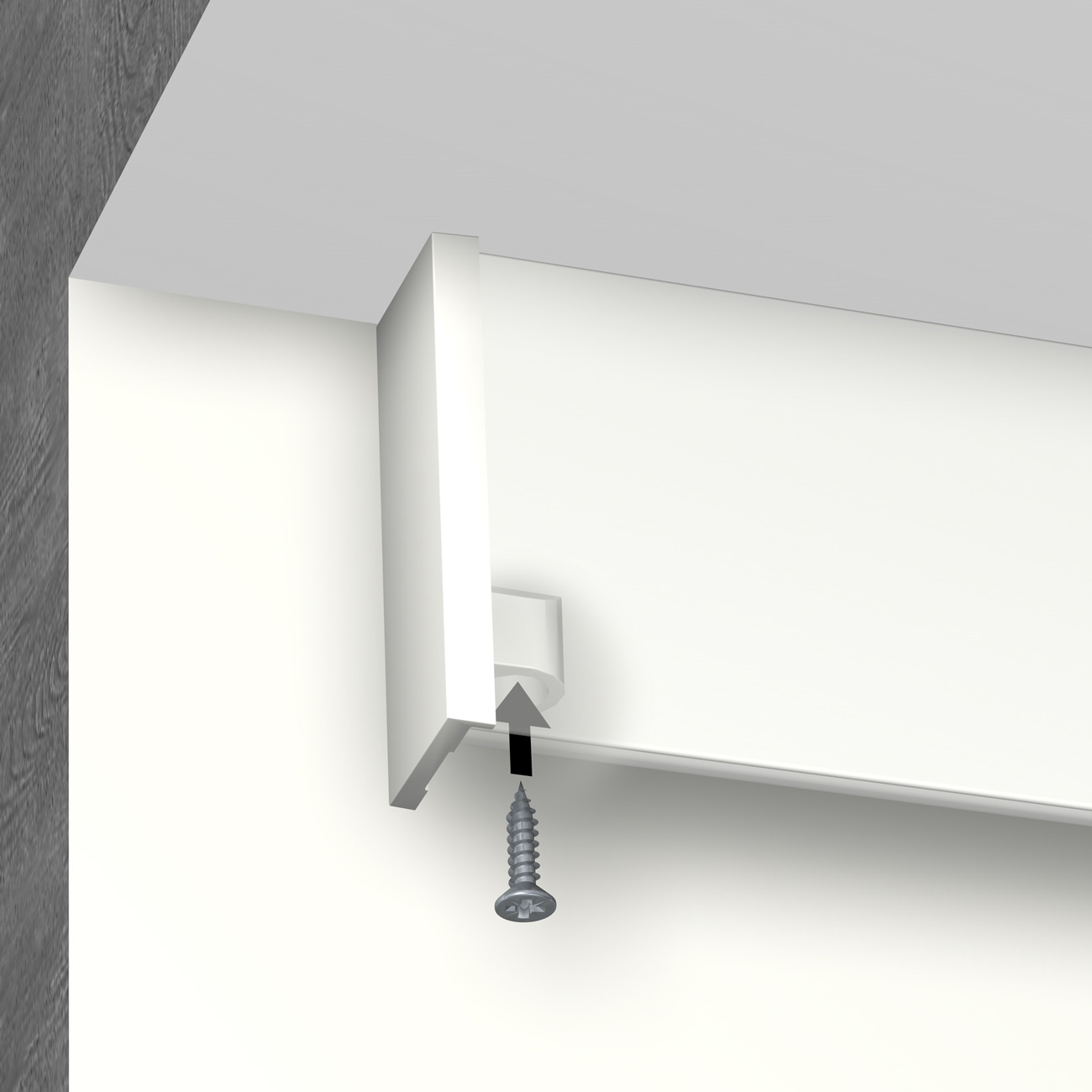 Close-up of a white cabinet mounting bracket being screwed to a wall.